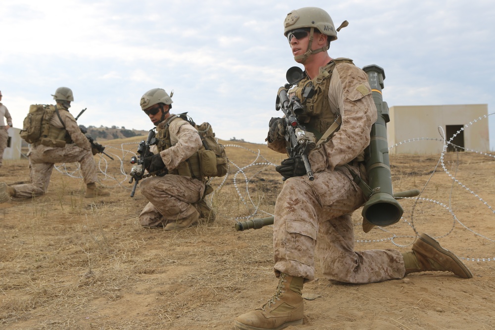 Recon Marines seize enemy objective during raid exercise