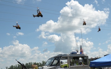 Scouts zip line over Coast Guard boat at National Jamboree