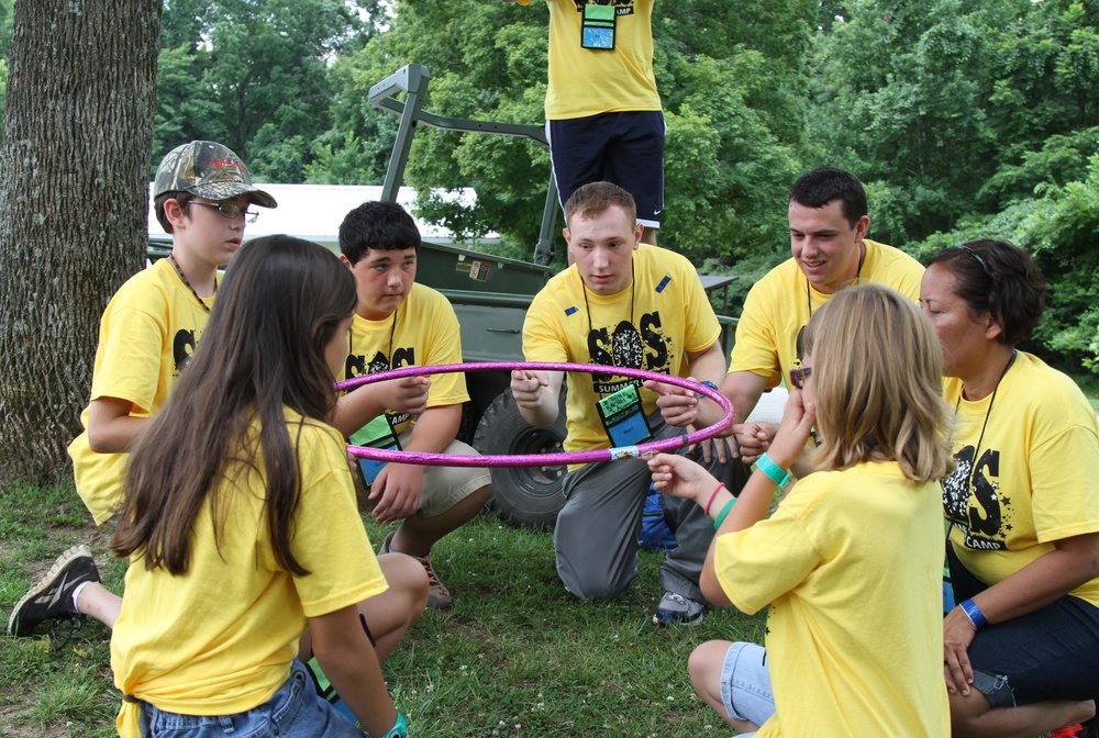 Soldiers happy to help kids at Camp SOS