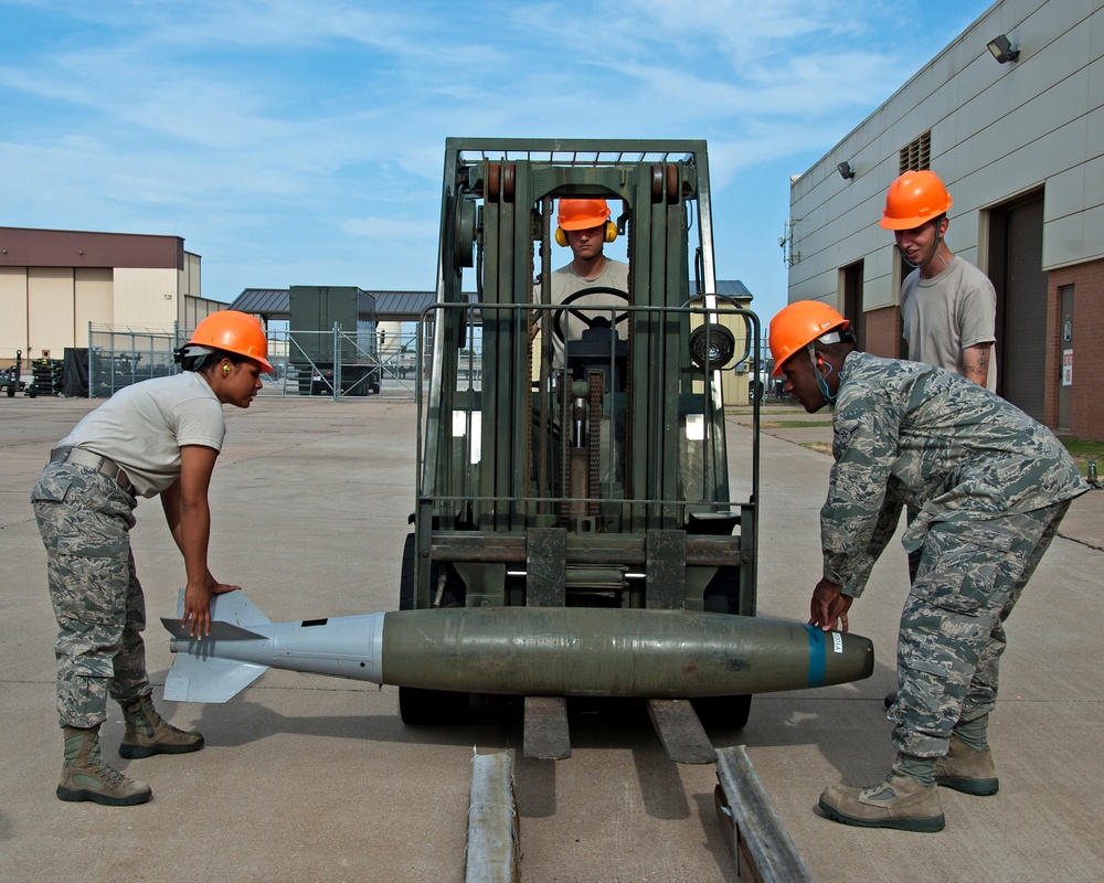 363rd Training Squadron places inert MK 82 LD munitions onto 40-foot rail set