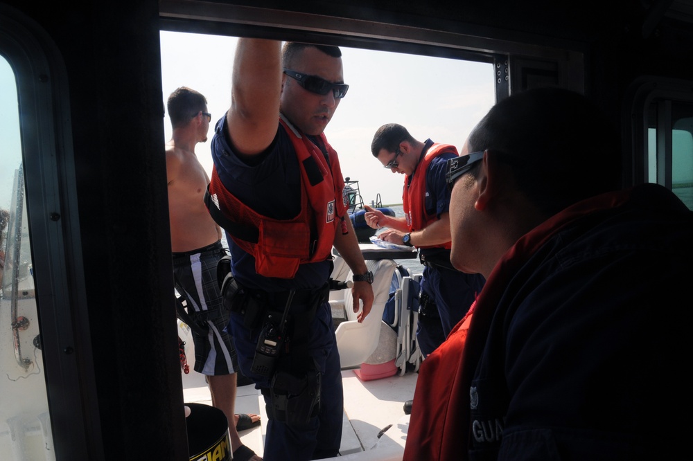 Coast Guard Station Fire Island boarding team members conduct safety inspections