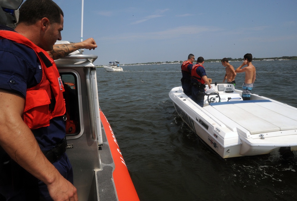 Coast Guard Station Fire Island boarding team members conduct safety inspections