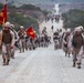 Marines shoulder packs, conduct regimental hike
