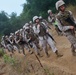 Marines shoulder packs, conduct regimental hike