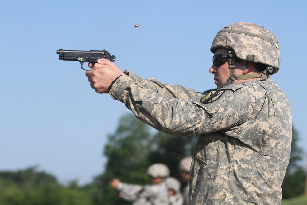 1st Lt. Samuel Bader of the 303rd MEB fires the 9 mm pistol during 2013 WAREX