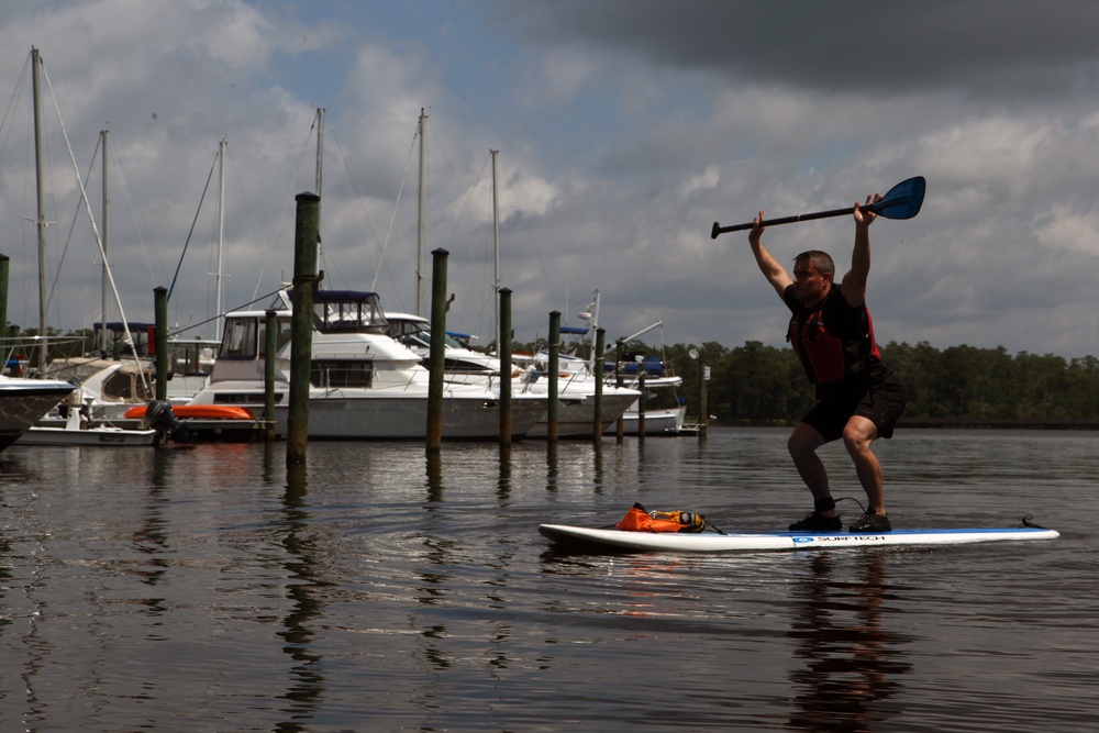 Paddleboard workout pushes physical limits on land, water