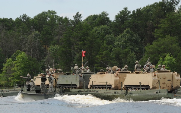 Airmen float with Army vehicles