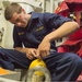 Midshipman practices refilling oxygen tank