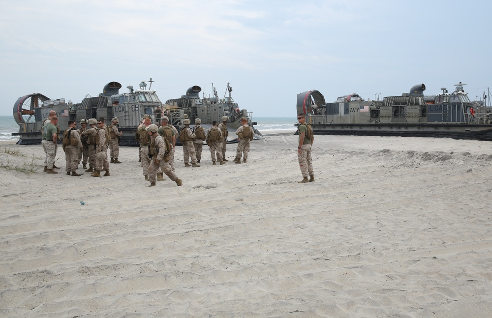 Marines storm the beach, conduct simulated rescue