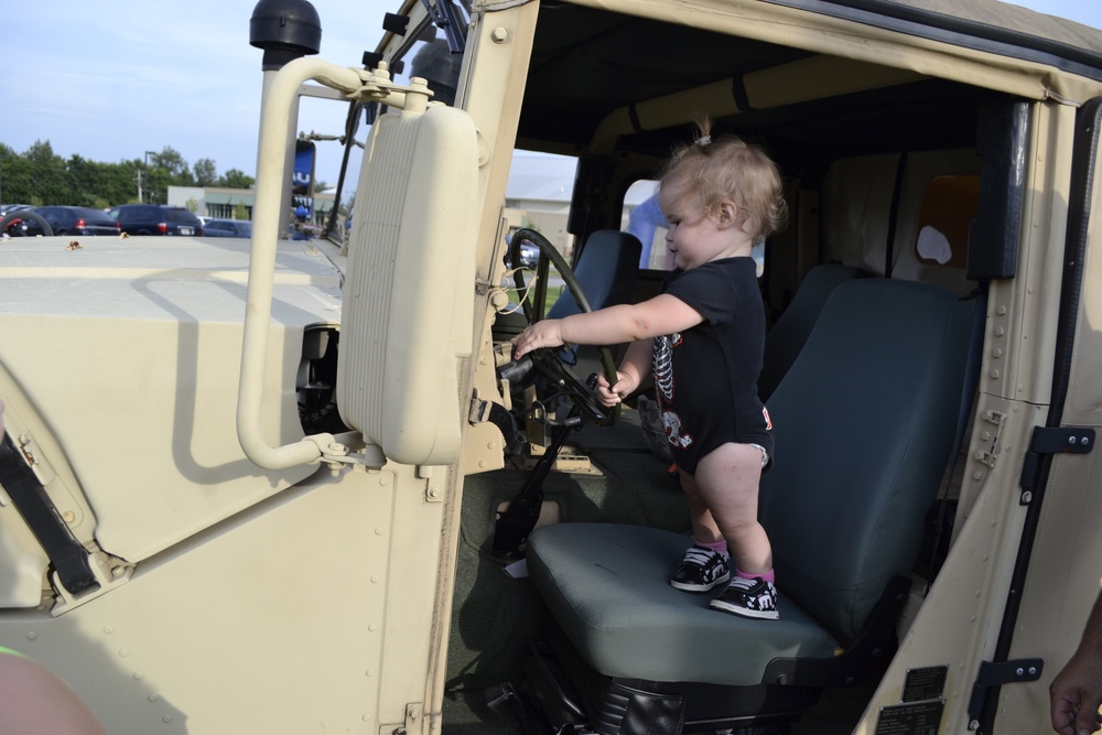 Hailie Jones, 15-months-old, checks out a Humvee on display