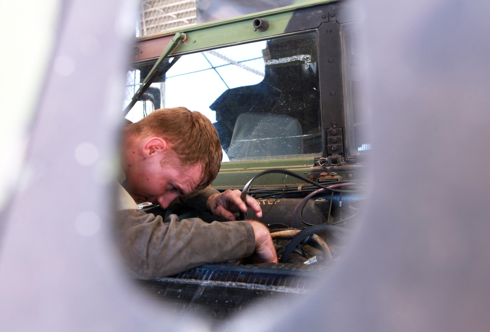 On the mend: MRF-D mechanics repair Humvees
