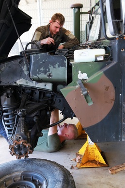 On the mend: MRF-D mechanics repair Humvees