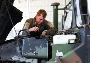 On the mend: MRF-D mechanics repair Humvees