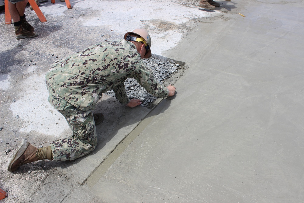 Concrete placement during UCT 2's pier repair on Ebeye Island in the Kwajalein Atoll