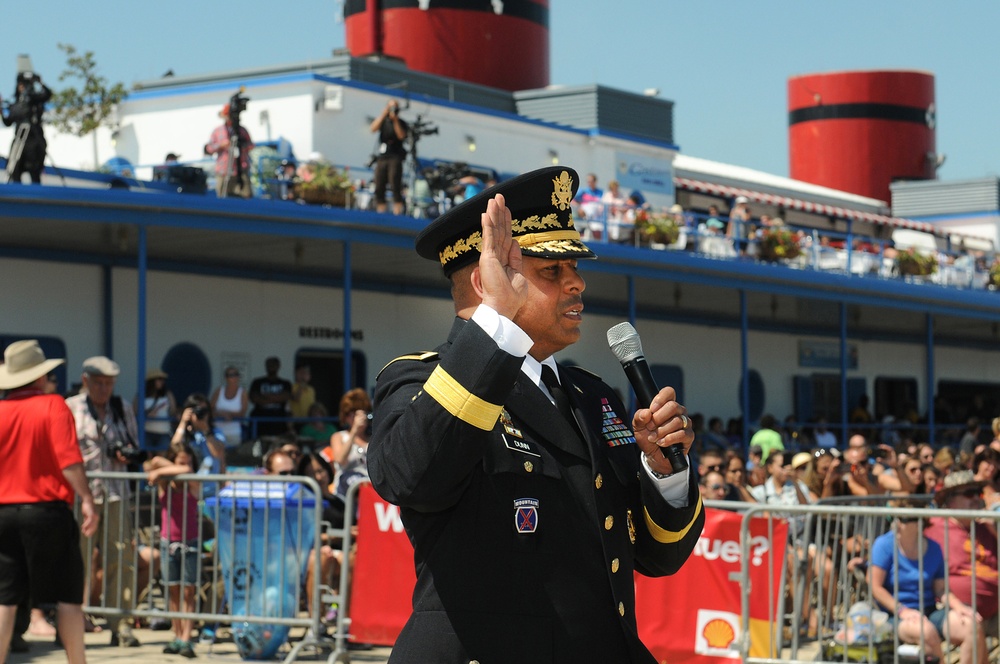 More than 50 recruits are sworn into the US armed forces during Chicago air show