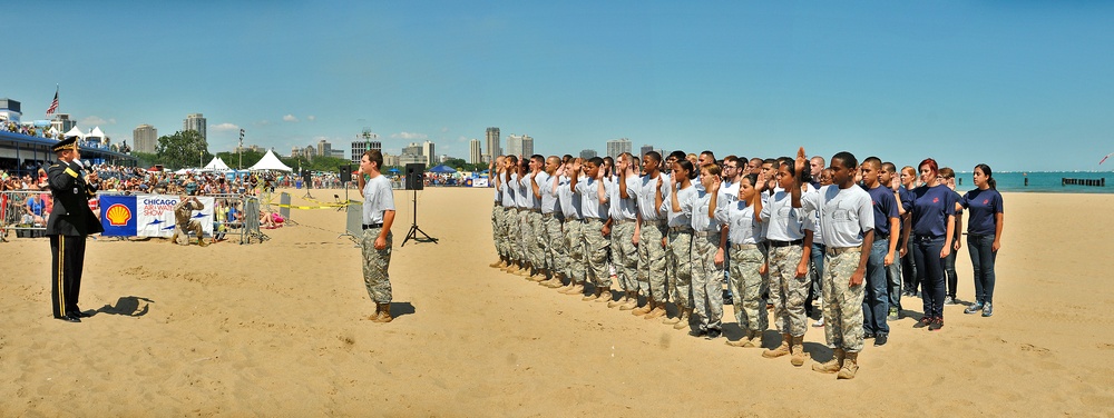 More than 50 recruits are sworn into the US armed forces during Chicago air show