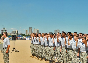 More than 50 recruits are sworn into the US armed forces during Chicago air show