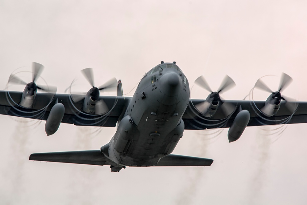 C-130 takes off with propeller vortices