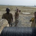 Airmen feed cable under flightline for new tower