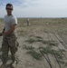 Airmen feed cable under flightline for new tower