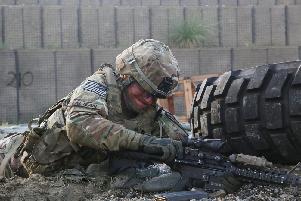 Pvt. Mark Faljean addresses a weapon malfunction during a stress fire exercise
