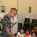Special-Purpose Marine Air-Ground Task Force Africa 13 pass out food to homeless