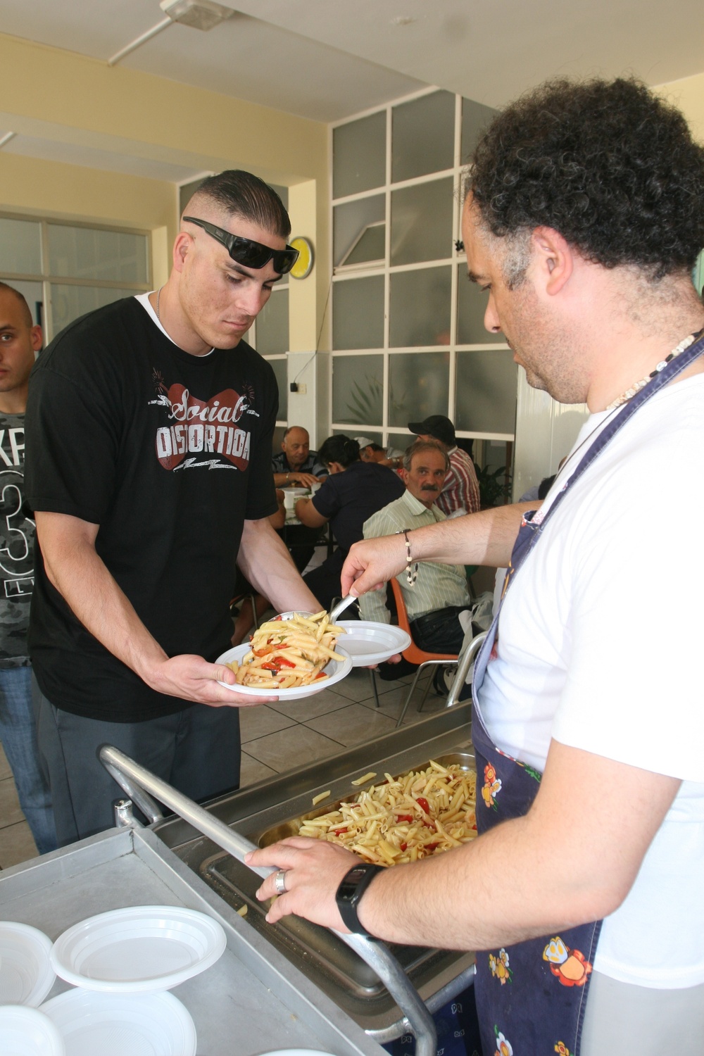 Special-Purpose Marine Air-Ground Task Force Africa 13 pass out food to homeless