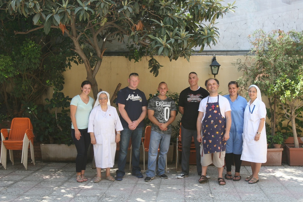 Special-Purpose Marine Air-Ground Task Force Africa 13 pass out food to homeless