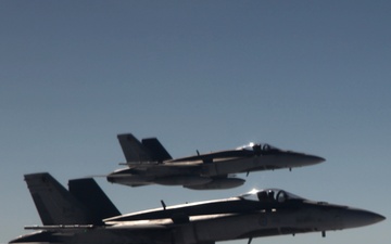 Two Canadian forces CF-18s prepare to intercept a simulated track of interest during Vigilant Eagle 2013