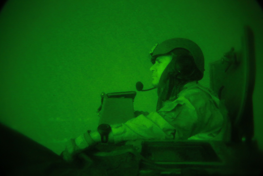 Amphibious assault vehicles perform nighttime assault