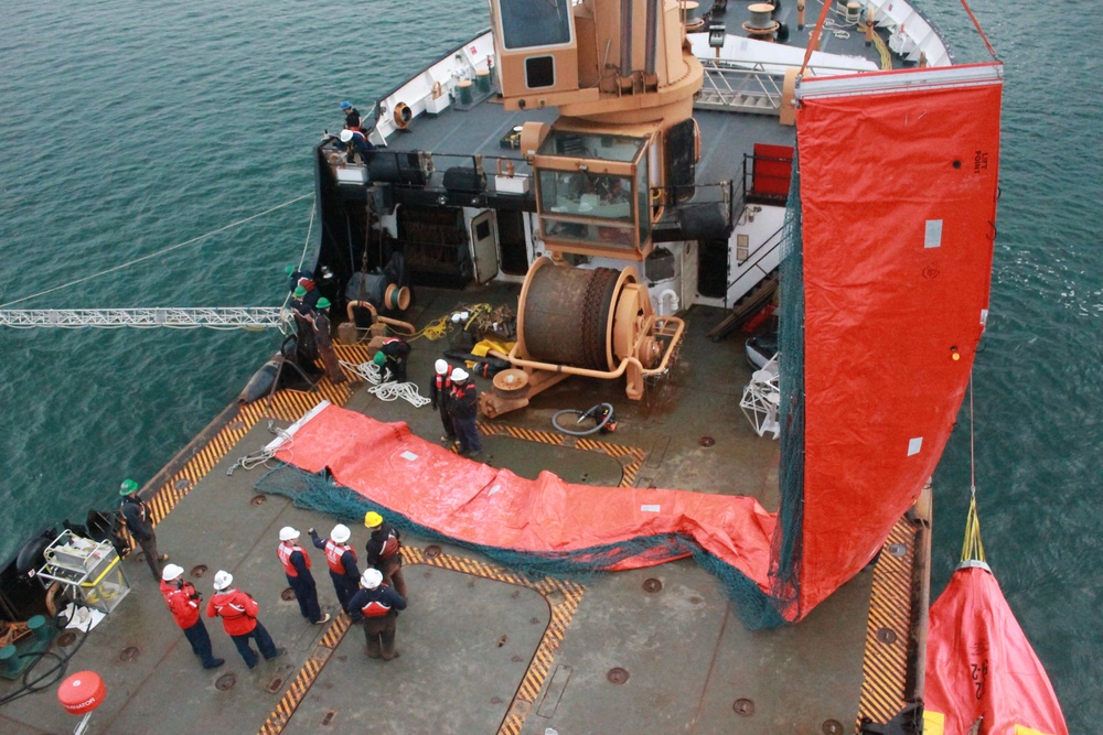 Coast Guard personnel conduct oil spill response training near Homer, Alaska