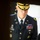 Lt. Gen. Dana Kyle Chipman retirement ceremony A U.S. Army general officer in dress blue uniform is standing with head bowed and hands clasped, appearing to be in a moment of reflection or prayer. His name tag reads 'CHIPMAN' and he wears a single star on his shoulder indicating the rank of Brigadier General. He is adorned with numerous medals, badges, and unit insignia consistent with a senior Army officer.