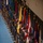 Lt. Gen. Dana Kyle Chipman retirement ceremony A formal military color guard ceremony featuring a long line of uniformed personnel standing at attention while holding ceremonial flags and guidons. The personnel are dressed in dark dress uniforms with black service caps and sunglasses, aligned along a blue floor inside what appears to be a large indoor venue. Multiple colorful military flags and unit colors are displayed, suggesting a significant official military event.