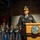 Lt. Gen. Dana Kyle Chipman retirement ceremony A senior U.S. Army officer is delivering a speech at a formal military ceremony from a podium bearing the Department of the Army seal. The officer wears a dress uniform with general officer rank insignia, service ribbons, and a name tag reading 'CHIPMAN.' A military honor guard stands in formation in the background.