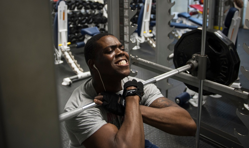 USS George H.W. Bush sailor works out