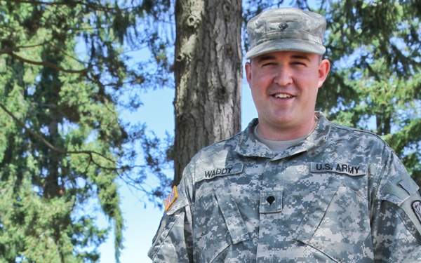 17th Fires Brigade soldier aids 2 children locked in car