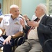 Rear Adm. Frederick J. Kenney shares a moment with Robert Devaney, the oldest Coast Guardsmen in residence at the Armed Forces Retirement Home during a Coast Guard birthday celebration in Washington, DC