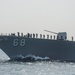 USS The Sullivans renders passing honors to USS Monterey