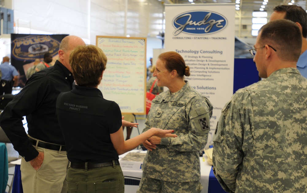 US Army Col. Stephanie Rivers, Rear Detachment commander of the 143rd Expeditionary Sustainment Command, speaks with employers