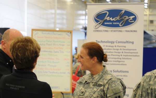 US Army Col. Stephanie Rivers, Rear Detachment commander of the 143rd Expeditionary Sustainment Command, speaks with employers