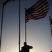 Soldiers raise American flag at coalition base