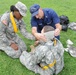 US Coast Guard Chief Petty Officer Bartonlini demonstrates proper use of bandages to soldiers at OSW