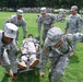 Soldiers carry medical litter at Operation Sustainment Warrior