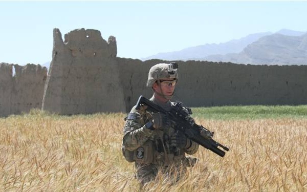 Army engineer searches on open field for IEDs in eastern Afghanistan