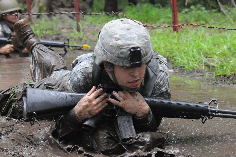 OSW soldier low crawls through mud