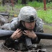 OSW soldier low crawls through mud