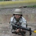 OSW soldier low crawls through mud