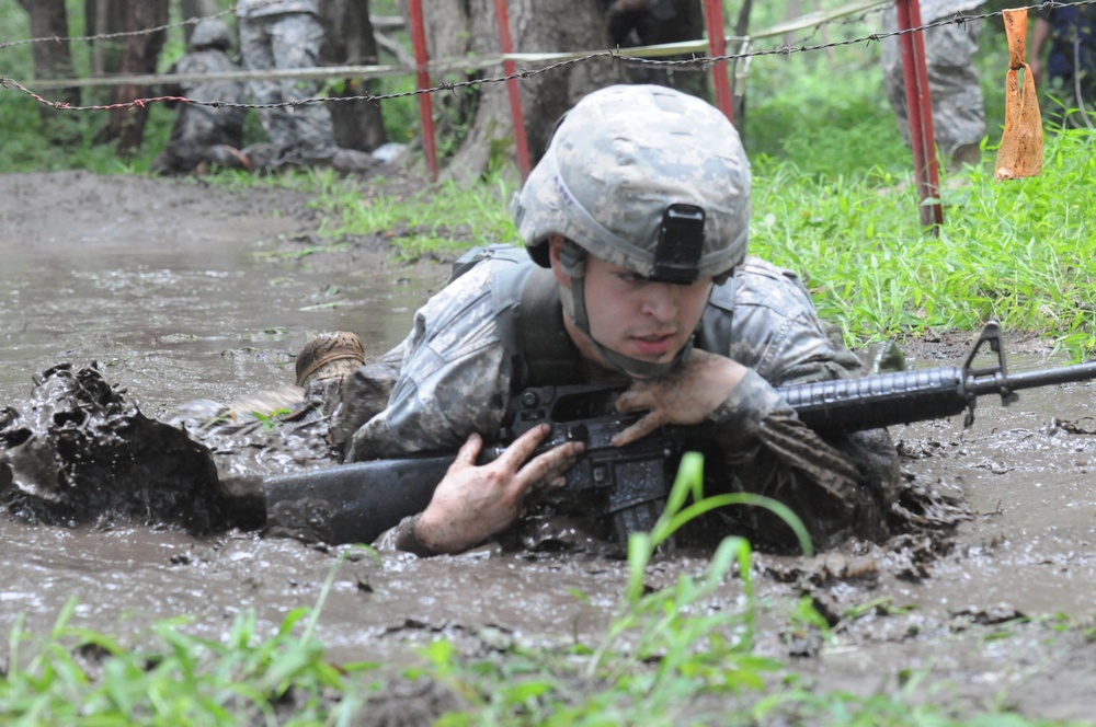 OSW soldier low crawls through mud