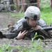 OSW soldier low crawls through mud