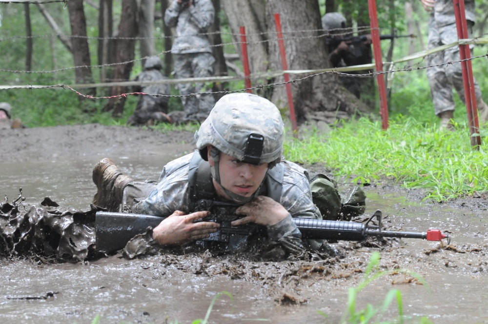 OSW soldier low crawls through mud